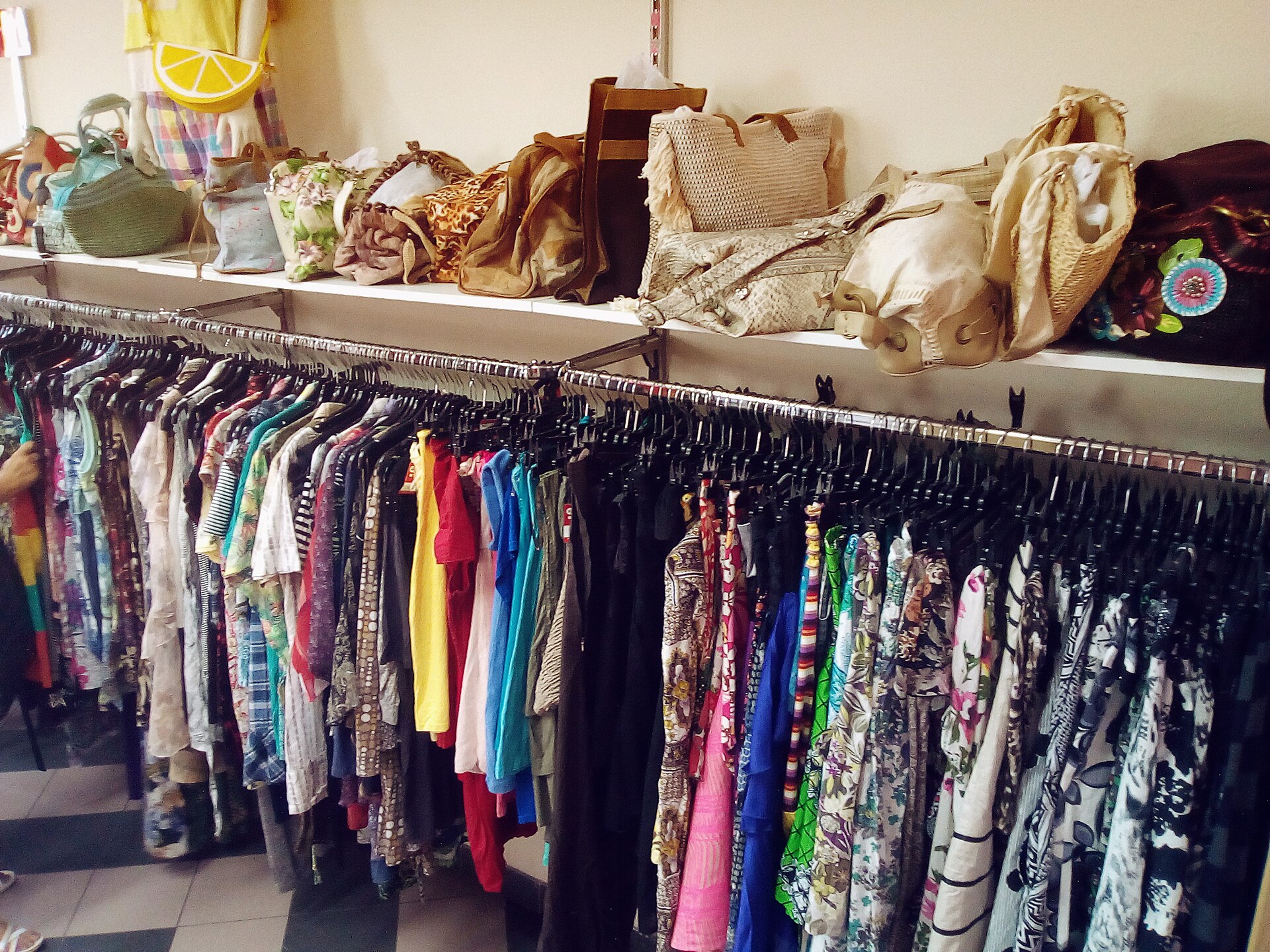 Clothing racks and handbags in a second-hand shop